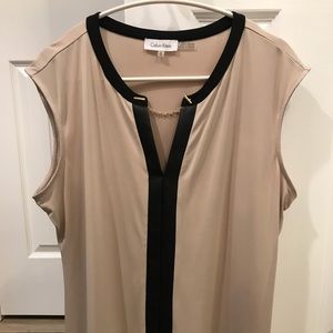 Sleeveless Beige and Black Calvin Klein shirt